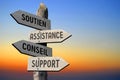 Soutien, Assistance, Conseil, Support - French/ help, assistance, advice, support - English - wooden signpost, sunset sky Royalty Free Stock Photo