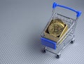 souvenir bitcoin coin in supermarket trolley