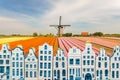 Souvenir canal houses in front of a typical ducth landscape Royalty Free Stock Photo