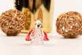 Souvenir crystal angel, golden balls and champagne gift bottle on wooden table