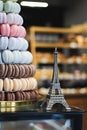 Souvenir Eiffel tower and colored macarons Royalty Free Stock Photo