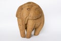 A souvenir figurine of an elephant made of coconut on an isolated white background. Royalty Free Stock Photo