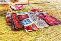 Souvenir on Floating islands Titicaca lake, Peru,South America. Street shop with colorful blanket, scarf, cloth, ponchos