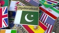 Souvenir magnet or badge with Hyderabad text and national flag among different ones. Traveling to Pakistan conceptual 3D