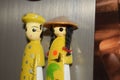 Souvenir magnets from vietnam on fridge