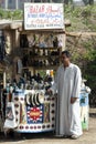 A souvenir seller stands next to his stall at the ancient Egyptian capital of Memphis in northern Egypt.