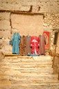 Souvenir shop and chilabas at the Kasbah Ait Ben Haddou in Ouarzazate, Morocco October 2019 Royalty Free Stock Photo