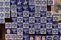 Souvenir shop display with colorful fridge magnet tiles with Jewish symbols, Toledo, Spain.