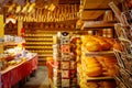 Souvenir shop in Netherlands with cheese and wooden shoes on the shelves. Tradition Holland klompen and clogs.