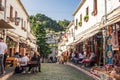 Souvenir shops and restaurants in old town of Gjirokaster in Albania. World Heritage Site by Unesco