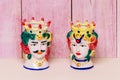 Souvenir from Sicily. Traditional Sicilian ceramic pots or vases with heads of a couple of lovers of Moorish heads on bright