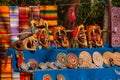 Souvenirs from Mexico in the market. Mexican Mayan crafts, embroidery on fabric, plates, pyramids