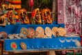 Souvenirs from Mexico in the market. Mexican Mayan crafts, embroidery on fabric, plates, pyramids