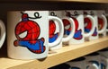 MINSK, BELARUS - December 20, 2019: Ceramic mugs on a shelf in the Miniso store with images of Spiderman Marvel superheroe.