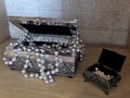 Souvenirs from silver and bronze. Decorative boxes. Jewelry made of pearls.