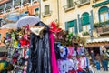 Souvenirs and Venice carnival masks on street kiosk display Italy