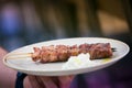 Souvlaki being served by waiter Royalty Free Stock Photo