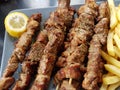 Souvlaki greek etnic food meat roasted in a plate wiht lemon and