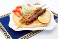 Souvlaki or kebab, grilled meat on pita bread with Royalty Free Stock Photo