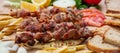 Souvlaki, meat skewers, traditional greek turkish meat food on pita bread and potatoes Royalty Free Stock Photo