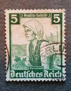 SOVATA, ROMANIA - Jul 02, 2020: old German stamp from 1935 with the image of a woman in a national costume Royalty Free Stock Photo