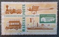 SOVATA, ROMANIA - Jul 02, 2020: Old postage stamp from Hungary shows locomotives, monoplanes, bus, steamer, and Budapest railroad Royalty Free Stock Photo