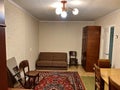 Soviet apartment with carpet and sofa