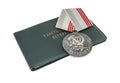 Soviet awards to workers. Certificate with inscription: `Veterans certificate` and a medal with inscription: `Veteran of labor`