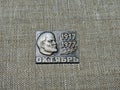 Soviet badge depicting Vladimir Ilyich Lenin Ulyanov with the inscription in Russian `1917-1977. October` from the collections