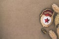 Soviet Bage ÃÂ«GuardÃÂ» and St. George ribbon, dried flowers and bullet on craft background