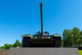 Soviet caterpillar tank T 54 in a green color. Monument. Front view from below.