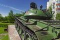 Soviet caterpillar tank T 54 in a green color. Monument.Rear side view.