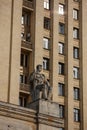 Soviet communist stone sculpture of a strong soldier sitting with a gun sculptors - Baburin, Nikogosyan, Anikushin. Kudrinskaya Royalty Free Stock Photo