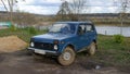 Soviet designed blue car Niva VAZ-2121, Oka River in the background, Tarusa, Kaluga Oblast, Russia