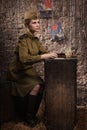 Soviet female soldier in uniform of World War II writes a letter Royalty Free Stock Photo