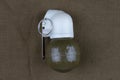 Soviet hand grenade RGN on khaki canvas Royalty Free Stock Photo