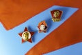 Soviet kids and youth badges with portrait of Lenin and red pioneer tie on blue