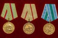 Soviet military medals of World War II on red background