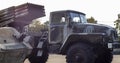 Soviet multiple launch rocket system BM-21 Grad on the chassis of a truck Ural-375D. Broken and burnt military equipment of the