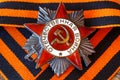 Soviet order of Patriotic War inscription Patriotic war with St. George`s ribbon. May 9 Victory day in the great Patriotic war Royalty Free Stock Photo