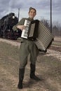 Soviet soldier with an accordion outdoors Royalty Free Stock Photo