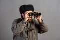 Soviet soldier with binoculars on guard, retro uniform. Theme of World War II Royalty Free Stock Photo