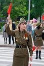 Soviet traffic controller in uniform of World War II indicates the direction on the Avenue of Heroes in Volgograd