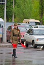 Soviet traffic controller in uniform of World War II indicates the direction in Volgograd