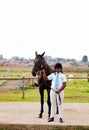 Young African boy holding the reigns of a horse