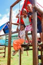 African kids playing on Jungle Gym and other park equipment at local public playground Royalty Free Stock Photo