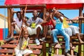 African kids playing on Jungle Gym and other park equipment at local public playground Royalty Free Stock Photo