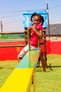 African kids playing on Seesaw and other park equipment at local public playground Royalty Free Stock Photo