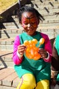 Young African Preschool children playing with animal balloons on the playground Royalty Free Stock Photo