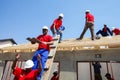 Diverse Community members building a low cost house in Soweto